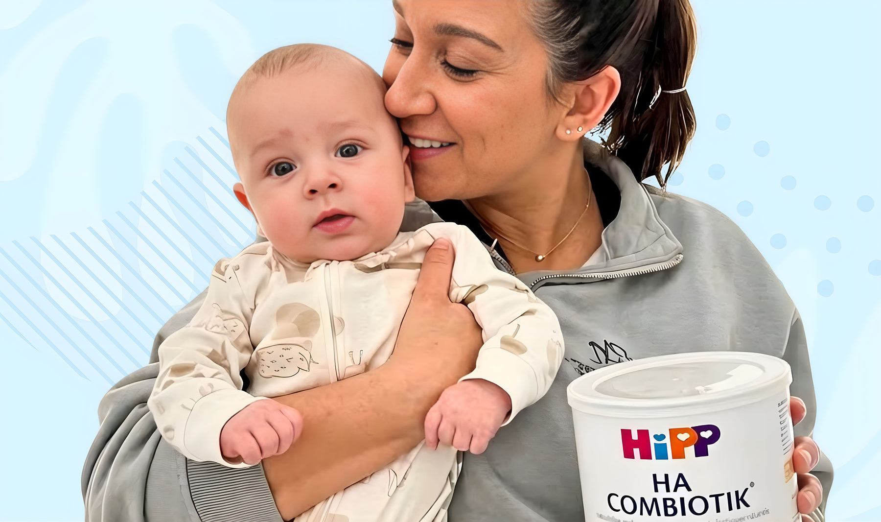 Mother holding baby with Organic's Best formula — join the club for free formula offers